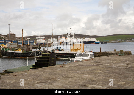 Lerwick Scotland UK Ferry and fishing boats moored in the harbour of this principal commercial port of the Shetland Islands sheltered deep water port Stock Photo