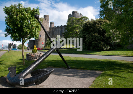 Giant anchor marks the quayside near to Conwy Castle in the market town of Conwy in north Wales by the river Conwy Stock Photo