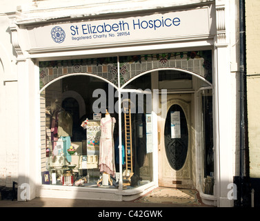 Charity shop window display, St Elizabeth Hospice, Woodbridge, Suffolk, England Stock Photo