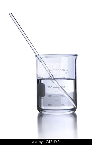 Laboratory beaker with liquid and stirrer isolated over white - With clipping path on glassware Stock Photo