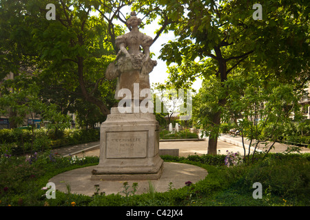 PARIS, FRANCE - MAY 08, 2011: La Grisette Flower Girl Statue in the public gardens which run down the centre of Boulevard Jules Ferry Stock Photo