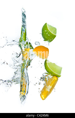 citrus fruit splashing isolated on white background Stock Photo