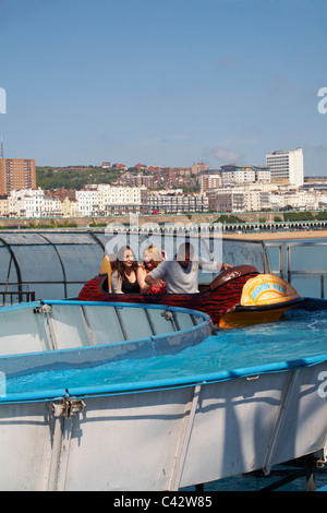 Having fun on the water rides on Brighton Pier in May Stock Photo