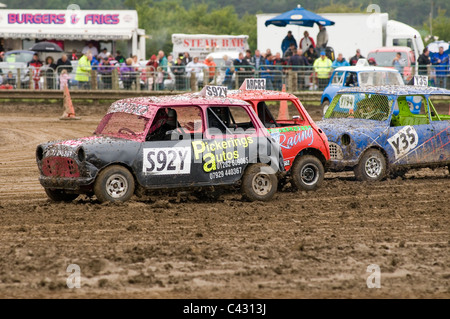 old minis at a grass track motoring racing event Stock Photo