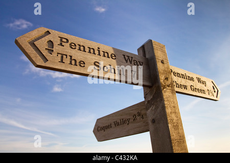 Pennine Way sign at the summit of Windy Gyle pointing to the Schil and Chew Green, Northumberland, England Stock Photo