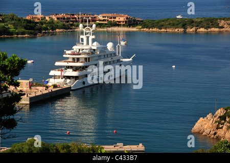 Porto Cervo marina with large motoryacht moored in harbour, Costa Smeralda,  Sardinia, Italy Stock Photo