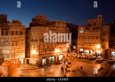 The entrance at Bab al Yemen, into the Old City of Sanaa, at dusk - Yemen Stock Photo