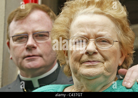 Bishop Pat Buckley with his mother Mrs Josephine Buckley outside the Oratory in Larne, County Antrim, Northern Ireland. Stock Photo