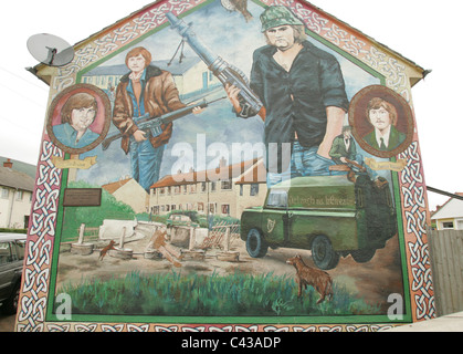 Murals painted in memory of dead IRA men, seen on the wall of a house in Ballymurphy, west Belfast, Northern Ireland. Stock Photo