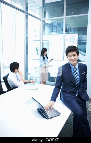 woman doing presentation to people in meeting room Stock Photo