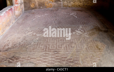 Geometric patterns in a mosaic floor at the ancient Roman town of Herculaneum Stock Photo