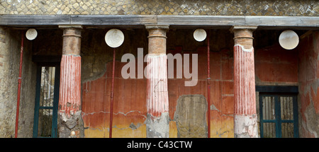 House of the Relief of Telephus at Herculaneum, showing Doric columns and oscilla (swinging marble discs to ward off evil) Stock Photo