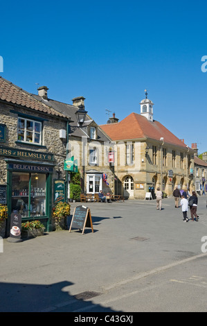 Local stores shops in the Market Place in spring Helmsley North Yorkshire England UK United Kingdom GB Great Britain Stock Photo