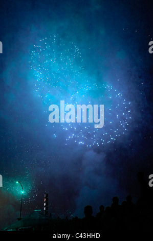 Fireworks light the sky  during Festa de Sao Joao do Porto or Festival of St John of Porto which happens every year during Midsummer to pay a tribute to Saint John the Baptist on the night of 23 June (St John's Eve) in the city of Porto, northern Portugal Stock Photo