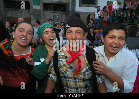 Members of the Gypsy community celebrating Festa de Sao Joao do Porto or Festival of St John of Porto which happens every year during Midsummer to pay a tribute to Saint John the Baptist on the night of 23 June (St John's Eve) in the city of Porto, northern Portugal Stock Photo