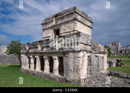 Temple of the Frescos in Tulum, Mexico showing the columns at the entrance and bas-relief on the facade Stock Photo