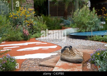 Gardeners boots left in the The Australian Garden at The RHS Chelsea Flower Show 2011 Stock Photo