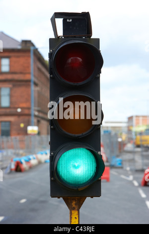 temporary traffic lights in the uk showing green Stock Photo