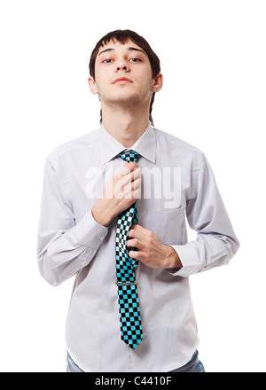 Young man holding his tie isolated on white bakground Stock Photo