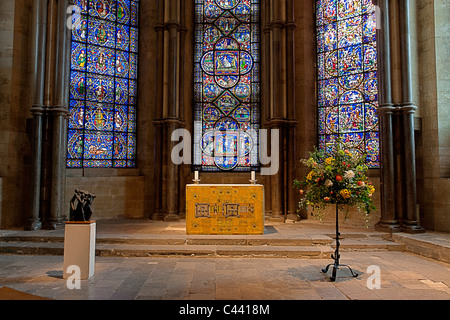 England, Canterbury Cathedral. Interior. Altar in the trinity chapel, with three stained-glass windows behind. HDR Stock Photo