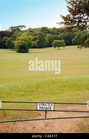 A 'Strictly Private' sign preventing access to countryside in a meadow, Cambridgeshire UK Stock Photo