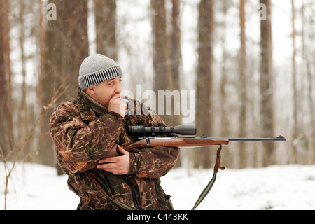 man with shotgun and cigarette Stock Photo - Alamy