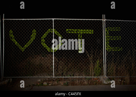 VOTE spelt on a chain link fence Stock Photo