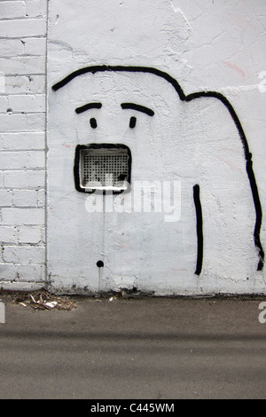 Drawing of a dog spray painted on a wall Stock Photo