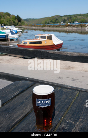 A pint of Doom Bar bitter from Sharp's brewery of Rock outside the Fisherman's Arms Inn, Golant, Cornwall. Stock Photo