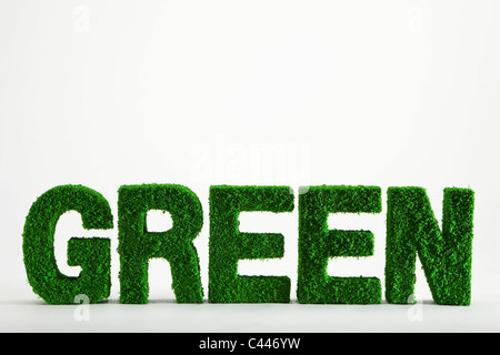 The word Green made from grass covered objects Stock Photo