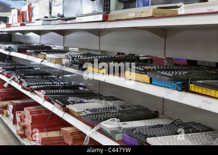 Rows of computer keyboards for sale in an electronics store Stock Photo