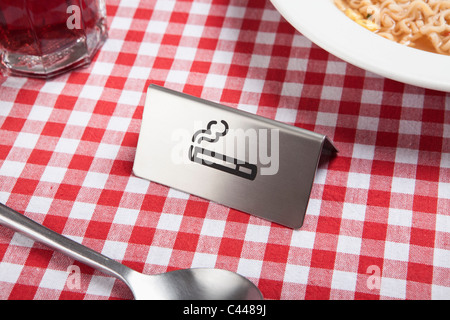 A smoking sign on a restaurant table Stock Photo