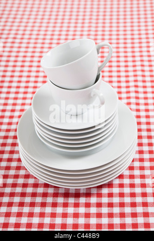 A stack of plates, saucers and coffee cups Stock Photo
