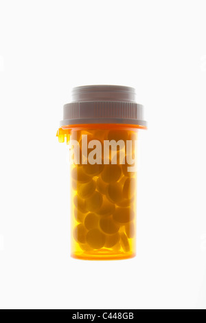 A closed pill bottle full of pills