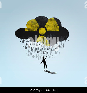 A cloud with a radioactive symbol raining on a person Stock Photo