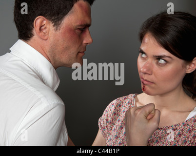 A woman and man fighting Stock Photo