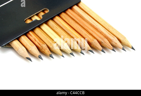The yellow ground pencils in a black box lie is isolated on a snow-white backgr Stock Photo