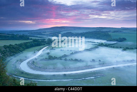 Mist lying in the Cuckmere Valley near Alfriston on a beautiful spring morning. This is part of the South Downs National Park Stock Photo