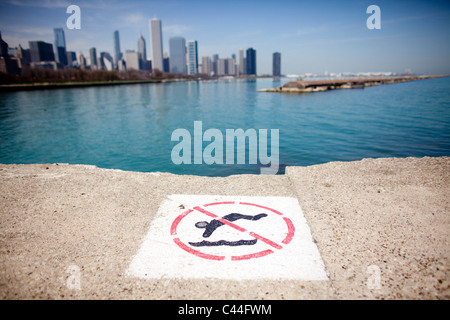 No diving sign on Lake Michigan with downtown Chicago in the background. Stock Photo