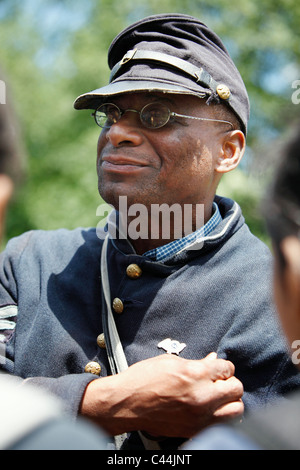 Reenactor in the uniform of the 54th Massachusetts Volunteer Infantry Regiment, an all black unit in the American Civil War Stock Photo