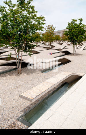 The Pentagon Memorial is in remembrance of the events of September 11, 2001, and the 184 people who died as victims of the terrorist attack on the Pentagon. The Memorial is adjacent to the southwest side of the Pentagon. Designed by Julie Beckman and Keith Kaseman, the memorial opened to the public on September 11, 2008, it is designed with one illuminated for each victim of the attack, arranged by the person's age. Each bench has a small pond of water underneath, and a name is etched on the end of each bench. Stock Photo