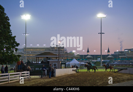 Thoroughbred Horses Getting a Morning Workout seen from the Backside of Churchill Downs at Sunrise in Louisville, Kentucky Stock Photo