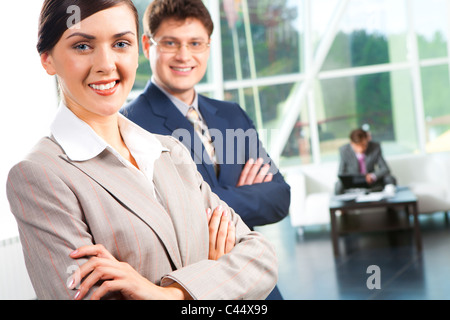 Portrait of two smiling partners folding their hands Stock Photo