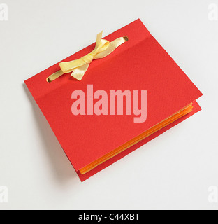 Red notebook with ribbon binding, close-up Stock Photo