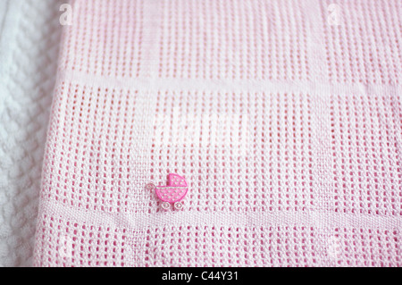 Pink blanket with appliqued pram patch, close-up Stock Photo