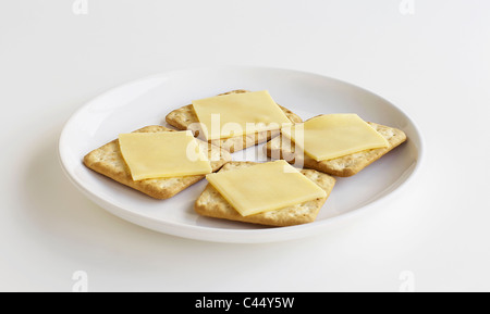Slices of cheese on crackers, close-up Stock Photo