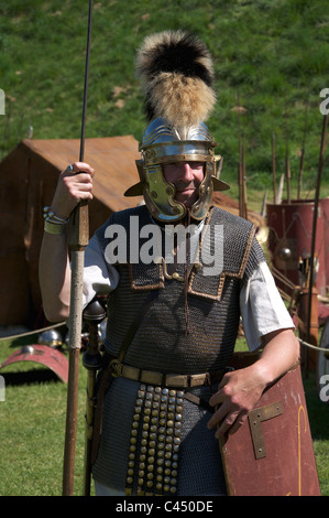 A Roman soldier of the LEG II AVG historical re-enactment group during a display at Maumbury Rings in Dorchester, Dorset, England, United Kingdom. Stock Photo