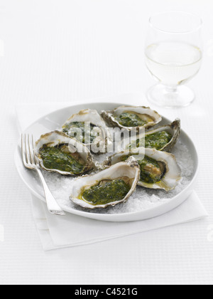 Plate of oysters on crushed ice, close-up Stock Photo