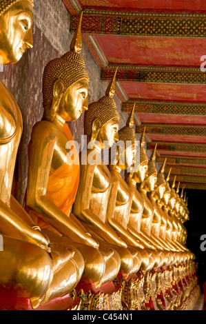 Thailand, Bangkok, Wat Suthat, Row of Buddha statues Stock Photo
