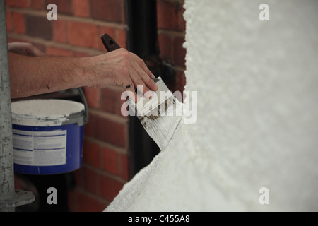 Painting the exterior of a house Stock Photo